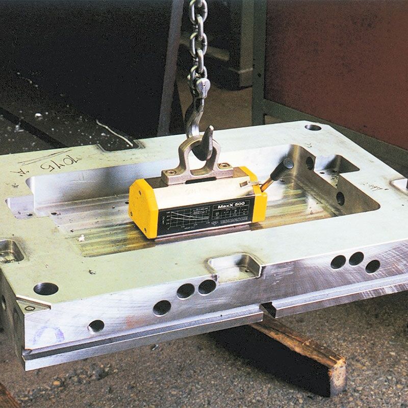 magnetic lifter hoisting a machined metal plate