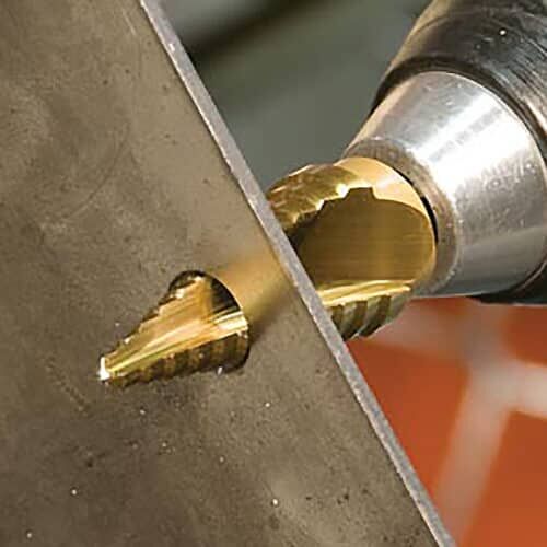 annular cutter drilling a hole through a metal plate